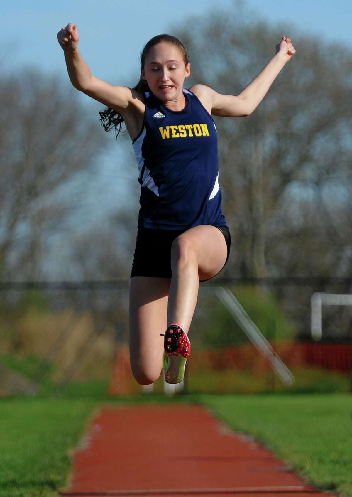 Weston's Chloe Shapiro competes in the triple jump event, during track action at Barlow High in Redding, Conn. on Tuesday April 30, 2013. Also competing were Immaculate and Masuk.