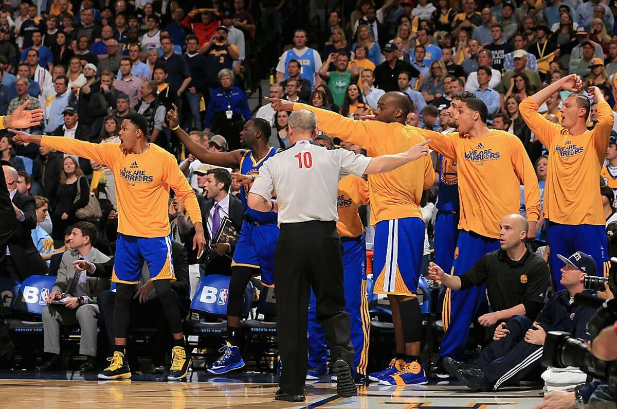 DENVER, CO - APRIL 30: The Golden State Warriors signal in the opposite direction of referee Ron Garretson #10 as he makes a call in favor of the Denver Nuggets during Game Five of the Western Conference Quarterfinals of the 2013 NBA Playoffs at the Pepsi Center on April 30, 2013 in Denver, Colorado. The Nuggets defeated the Warriors 107-100. NOTE TO USER: User expressly acknowledges and agrees that, by downloading and or using this photograph, User is consenting to the terms and conditions of the Getty Images License Agreement. (Photo by Doug Pensinger/Getty Images)