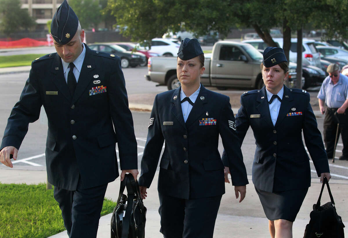 U.S. Air Force Staff Sergeant Emily Allen (center) walks to a hearing Wednesday May 1, 2013 at Joint Base San Antonio-Lackland. Allen is the first woman basic training instructor charged in the scandal at Joint Base San Antonio-Lackland and is charged with having sex with a trainee.
