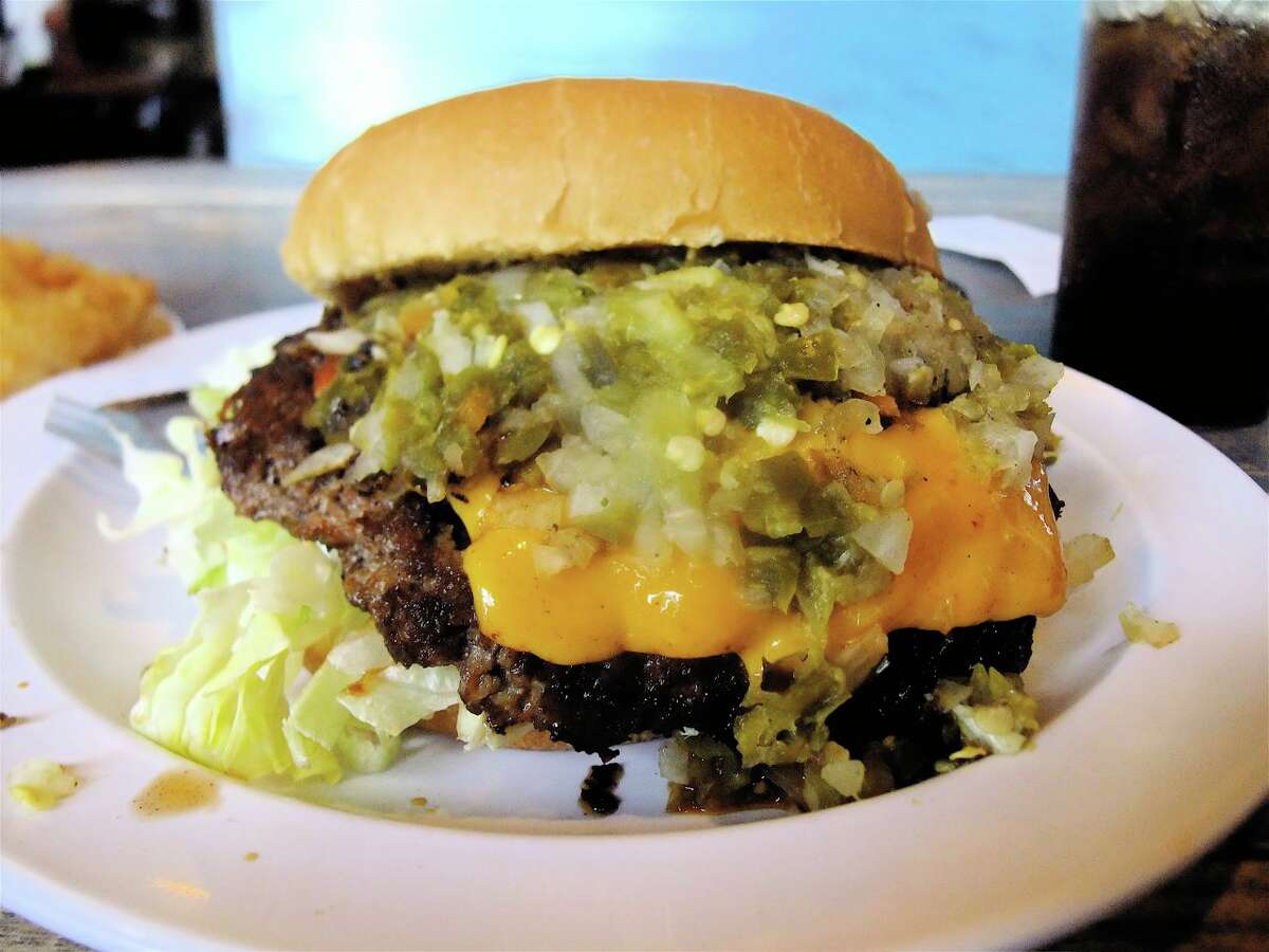 Stomp's Burger Joint Specialty burger ex.: Outlaw burger Beef patty, melted cheddar cheese, our special hot sauce blend, chopped jalapenos, grilled onion, shredded lettuce, tomatoes with mayo on a toasted bun. Location: 3107 Hwy 146, Bacliff Menu: stompsburgerjoint.com