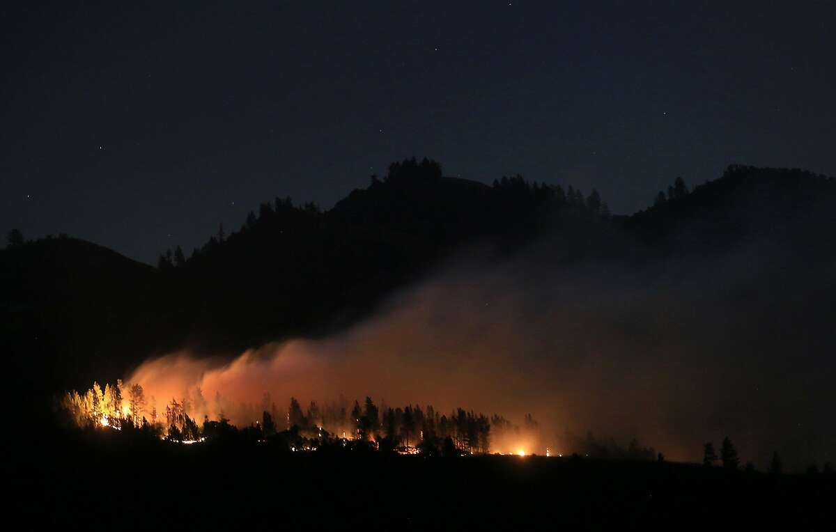 A wind driven vegetation fire eats up timber at the Yellow Jacket Ranch east of Highway 128, early Wednesday May 1, 2013 in Knights Valley, Calif., on the Napa and Sonoma County line. Crews battled two small wildfires on Wednesday in California wine country that were pushed by gusty winds.