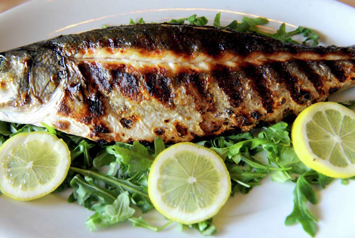 A Bronzini, whole grilled fish, at Athos Restaurant on Friday April 26, 2013 in Guilderland , N.Y. (Michael P. Farrell/Times Union)
