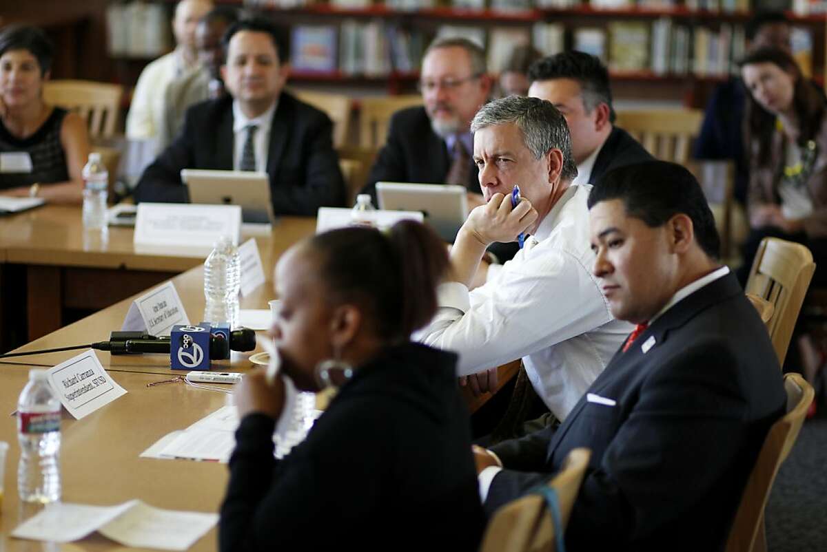 U.S. Secretary of Education Arne Duncan (top right) takes part in a roundtable discussion with San Francisco Unified School District principles, parents and administrators during a tour of Everett Middle School on Thursday, May 2, 2013 in San Francisco, Calif.