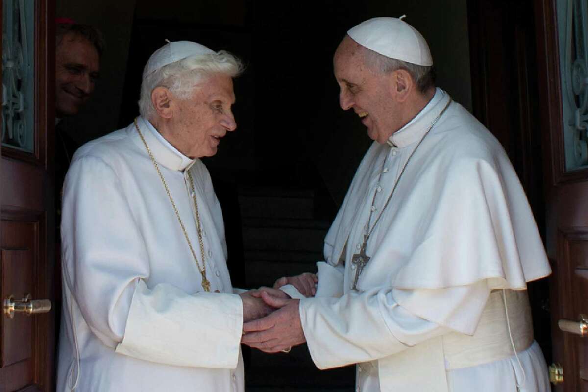 Pope Francis (right) greets Pope Emeritus Benedict XVI at the Mater Ecclesiae monastery, Benedict's new residence, after the former pope's arrival from Castel Gandolfo.