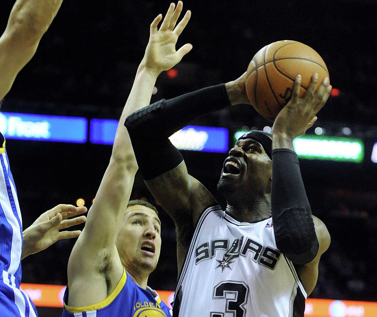Stephen Jackson of the San Antonio Spurs triple pumps and scores over Klay Thompson of Golden State during NBA action at the AT&T Center on Wednesday, March 20, 2013.