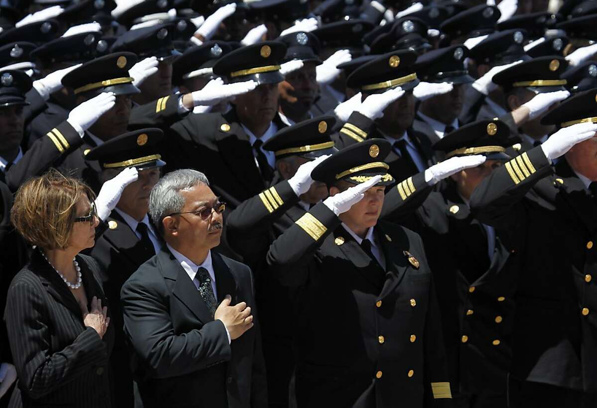 Rep. Nancy Pelosi, Mayor Ed Lee and Fire Chief Joanne Hayes-White salute as the bodies of firefighters Lt. Vincent Perez and Anthony Valerio arrive for the funeral service at St. Mary's Cathedral in San Francisco, Calif. on Friday, June 10, 2011.