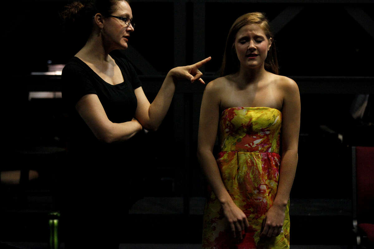 Kaitlin Hopkins (left) works with Lindsey Mader, 17, as Mader sings during a master class for finalists for a previous Las Casas Performing Arts Scholarship Competition. Las Casas Foundation will award $85,500 in scholarships at this year's competition on May 19.