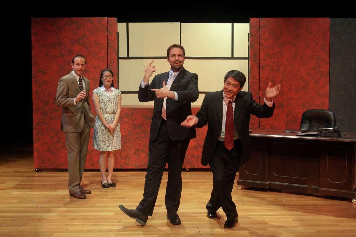 John Dunn, third from left, joins Mike Yager, left, Janice Pai Martindale and Jian Xin in Black Lab Theatre and Asia Society's premiere of David Henry Hwang's 2011 Broadway play "Chinglish."