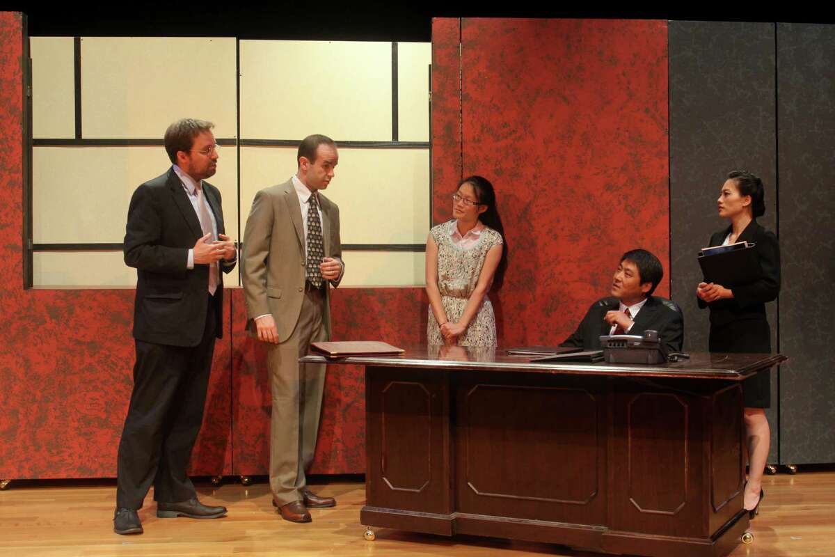 (For the Chronicle/Gary Fountain, May 1, 2013) John Dunn as Peter, from left, Mike Yager as Daniel, Janice Pai Martindale as Miss Qian, Jian Xin as Minister Cai, and Vivian Chiu as Xi, in this scene from Black Lab Theatre and Asia Society's Houston premiere of David Henry Hwang's 2011 Broadway play "Chinglish."