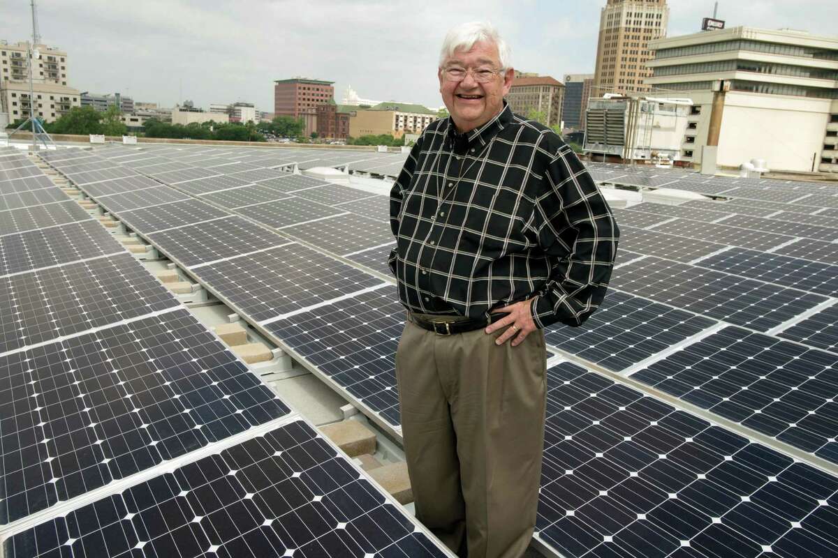 Pastor Skip Courter stands amidst a new solar panel array, Wednesday, May 1, 2013, on the roof of St. John's Lutheran Church in Downtown San Antonio. The array, which consists of 240 solar panels, is capable of producing up to 60 kilowatt-hours of electricity per day. (Darren Abate/For the Express-News)