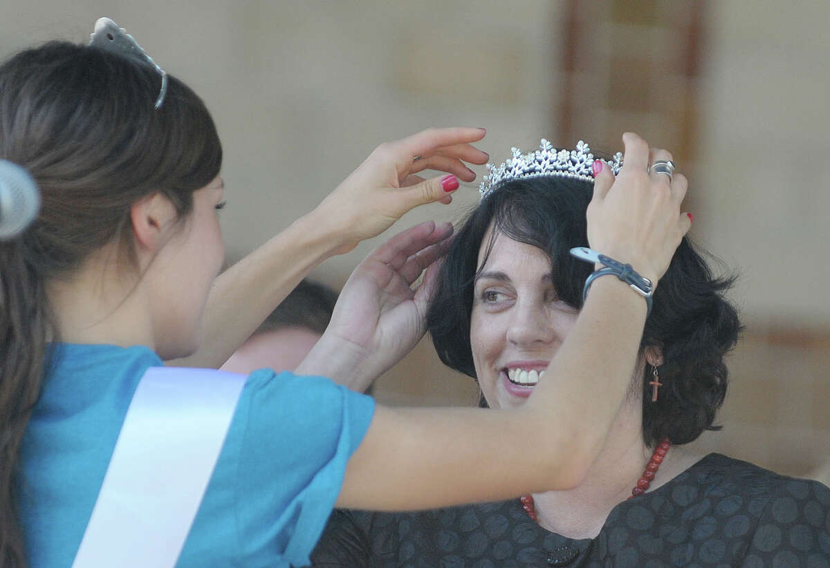 Tulip Queen Emily Finnegan, left, places a crown on Helen Hagen of Rexford after she was announced Mother of the Year at the Tulip Fest on Sunday, May 13, 2012 in Albany, NY. (Paul Buckowski / Times Union archive)