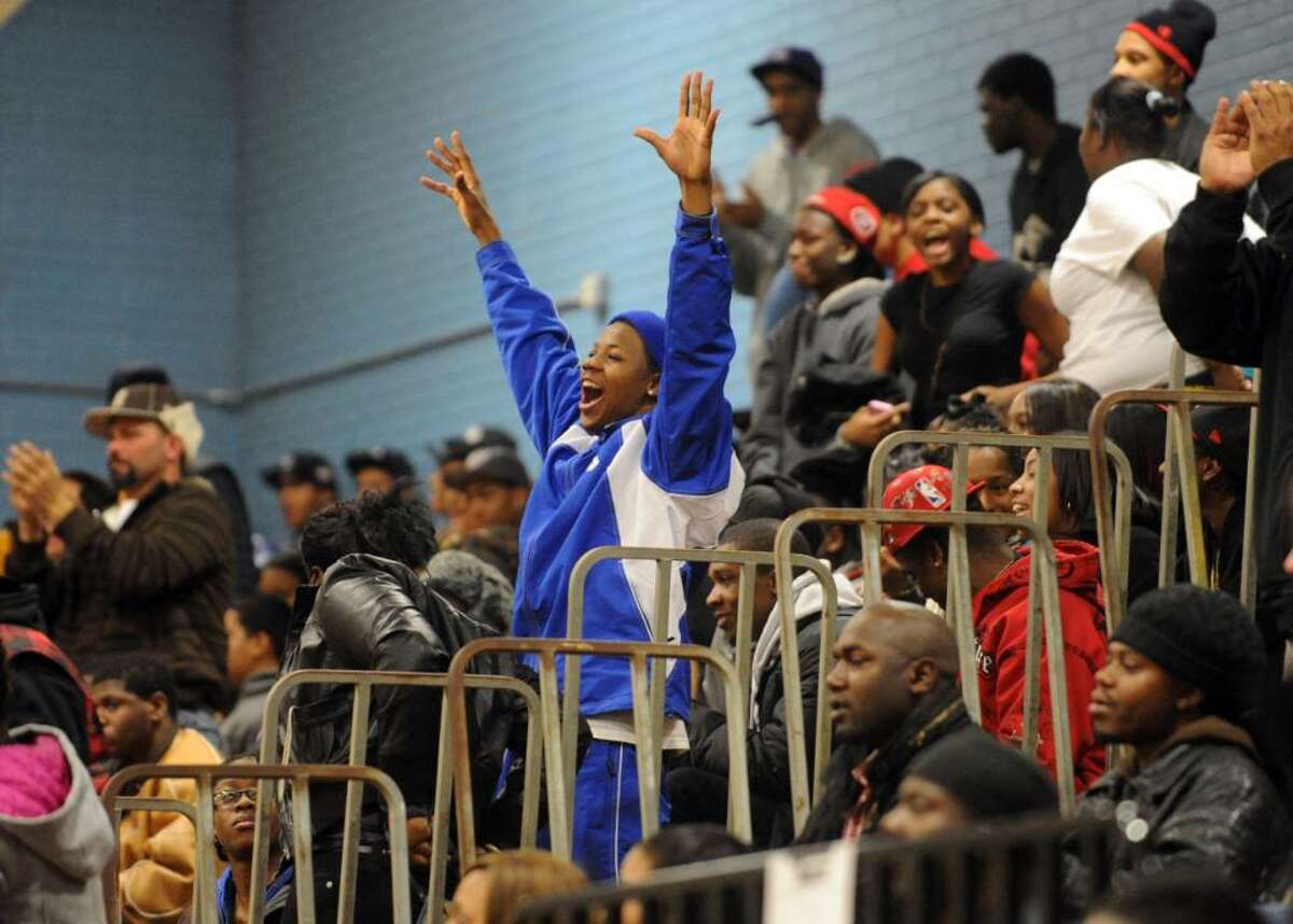 A Harding fan celebrates a score, during basketball action against Stamford in Bridgeport, Conn. on Friday Jan. 08, 2009.