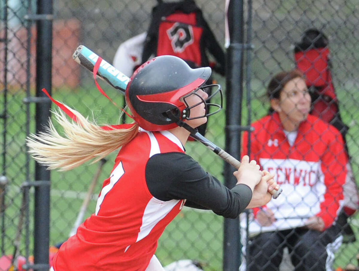Rebecca DeCarlo of Greenwich hits a bases-clearing triple driving in 3 runs during a 13-1 win over Wilton. DeCarlo is one of the top hitters for the Cardinals, who are averaging an FCIAC-best 10.7 runs per game.