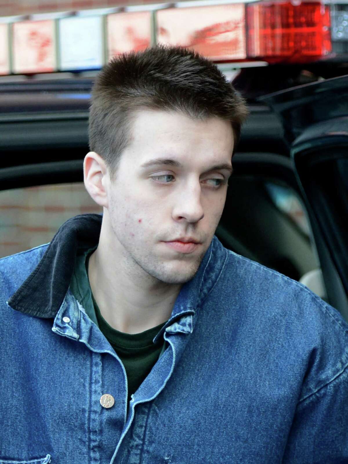 Dennis Drue, age 22, is led from a State Police car Monday, Jan. 7, 2013, to the Saratoga County Courthouse in Ballston Spa, N.Y. Drue allegedly drove the car which rear-ended an SUV killing two popular Shenendehowa High School students on the Northway last Dec. (Skip Dickstein/Times Union)