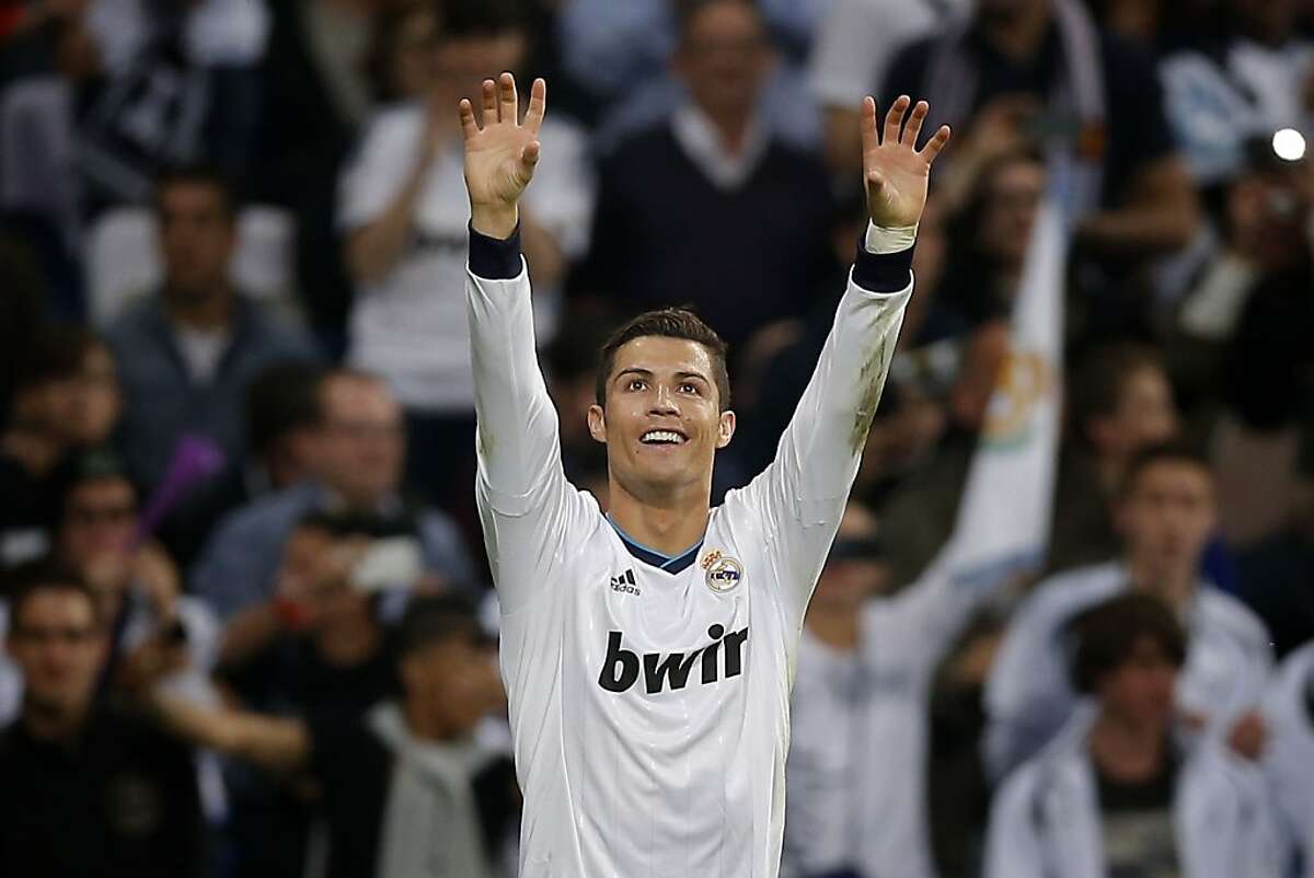 Real Madrid's Cristiano Ronaldo from Portugal celebrates after scoring during a Spanish La Liga soccer match against Valladolid's at the Santiago Bernabeu stadium, in Madrid, Saturday, May 4, 2013. (AP Photo/Daniel Ochoa de Olza)