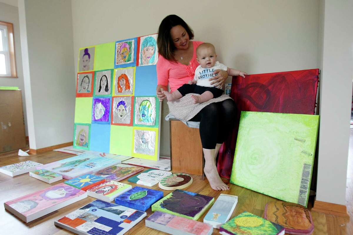 Kim Murray McDonald, with her son Wyatt, is founder of the Zoetica Project, which involves 12 local mothers who produced art during a nine-month workshop.