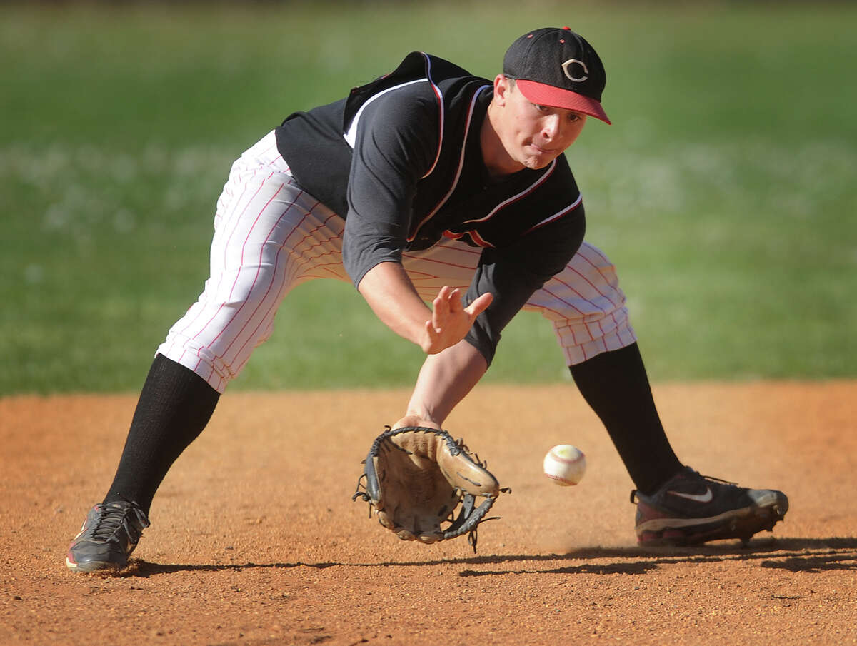 Central senior shortstop Eric Vilanova handles a ground ball during his team's victory over Harding at Central High School in Bridgeport, Conn. on Monday, May 6, 2013.