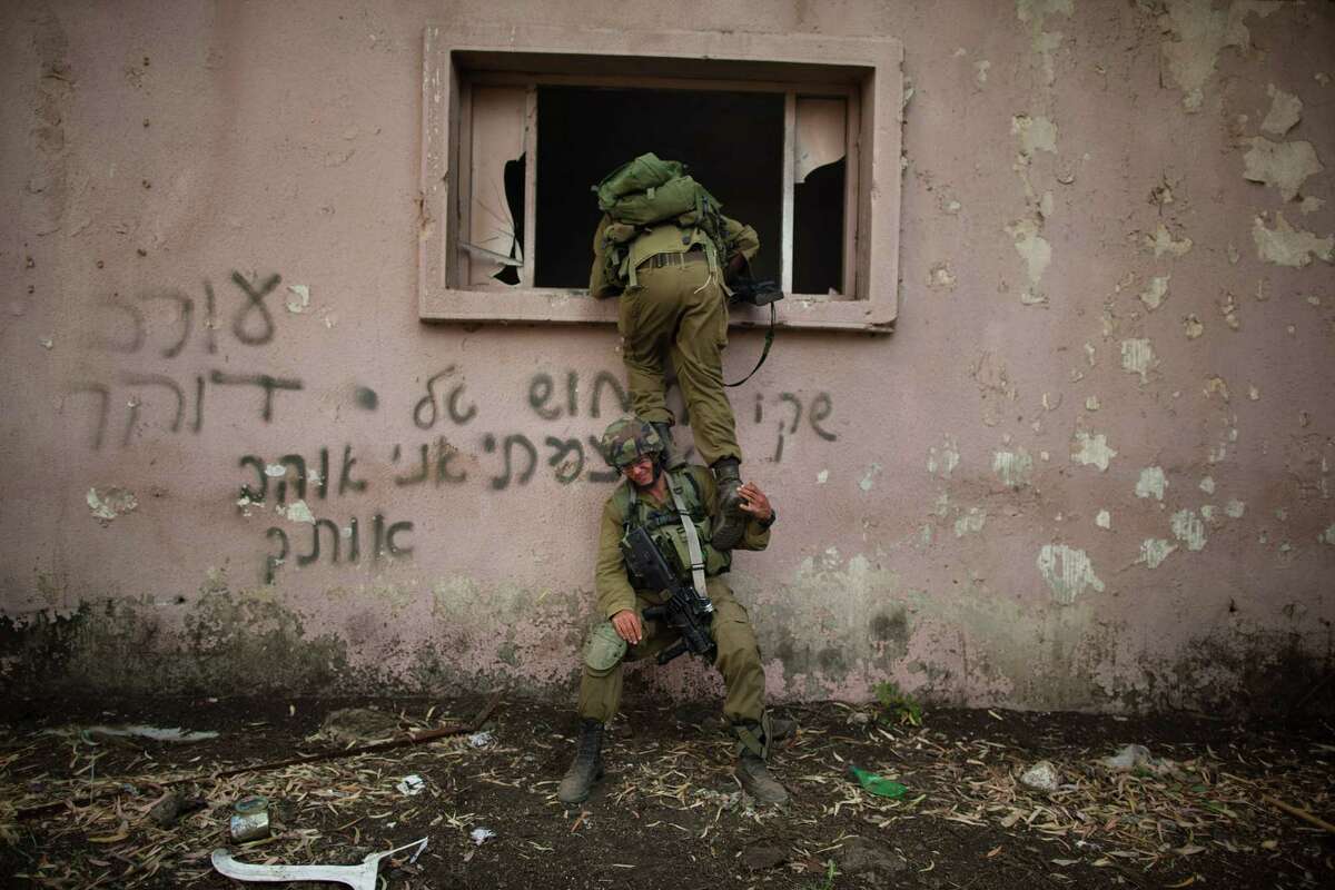 A Israeli soldiers of the Golani brigade take part in an exercise near the border with Syria on May 6, 2013 at the Israeli-annexed Golan Heights. Syria has accused Israel of launching a series of airstrikes on targets near the Lebanon/Syria border, including an arms shipment and the Jamraya research centre, that was thought to produce chemical weapons.