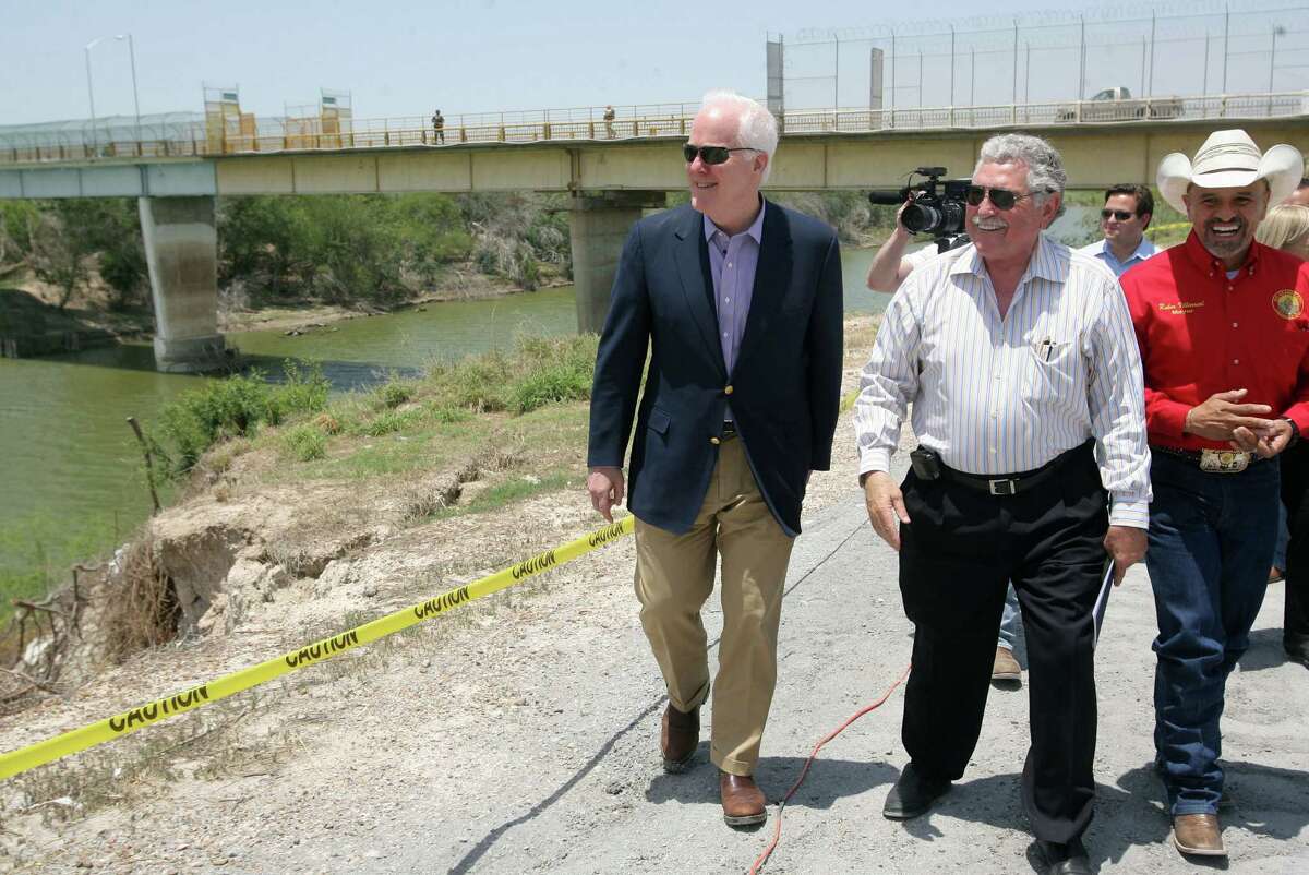 U.S. Sen. John Cornyn (from left); Sam Vale, owner of the Starr-Camargo International Bridge; and Rio Grande City mayor Ruben Villarreal walk near the bridge while discussing border issues. Rio Grande Valley officials are hoping for measures to facilitate cross-border trade.