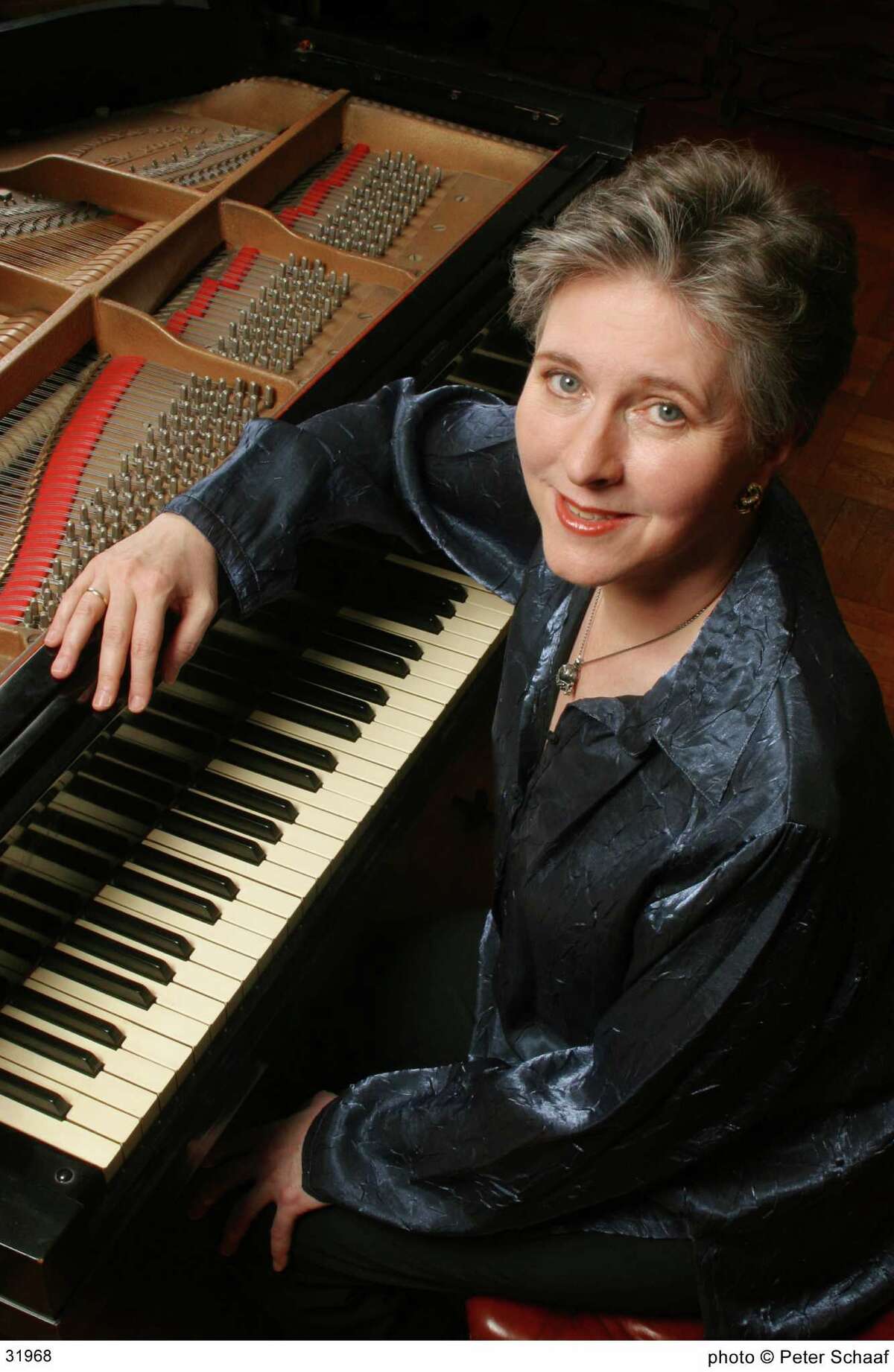 Pianist wills herself to return both hands to the keys