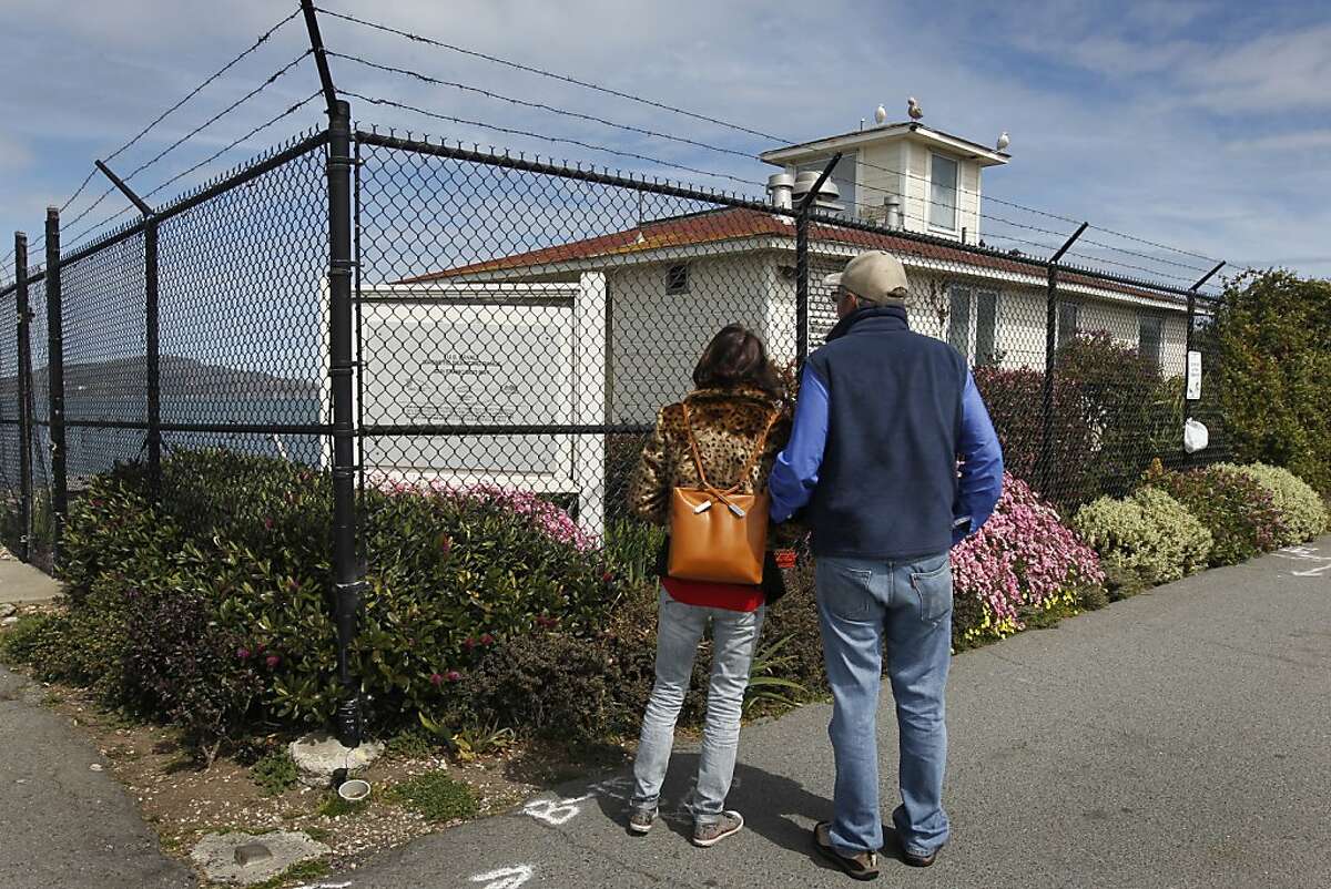 Pamela and Kent Russell stop to view the old Naval magnetic range house on the Marina Green in San Francisco, Calif. on Tuesday, March 26, 2013. The Russells think "it's a fabulous idea" to open an eatery at the site, where restaurateur Dylan MacNiven hopes to open one of his Woodhouse Fish Co. restaurants, but the plans have been met with opposition from nearby residents.