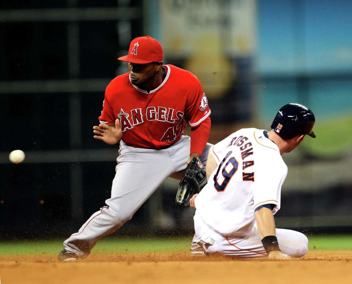 Robbie Grossman beats the throw to the Angels' Howie Kendrick for one of his two stolen bases in the seventh.