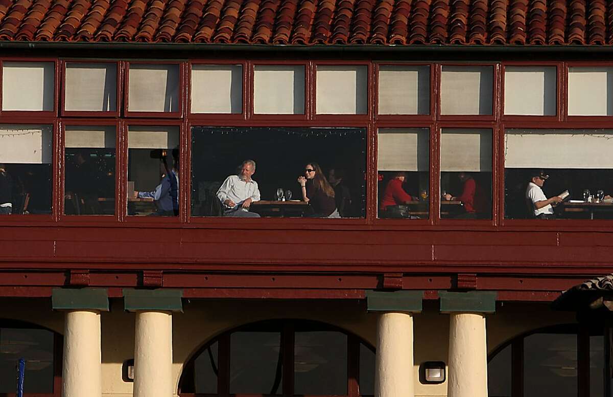 Diners looking out through the windows of the Beach Chalet in San Francisco, Calif., on Friday, December 23, 2011.