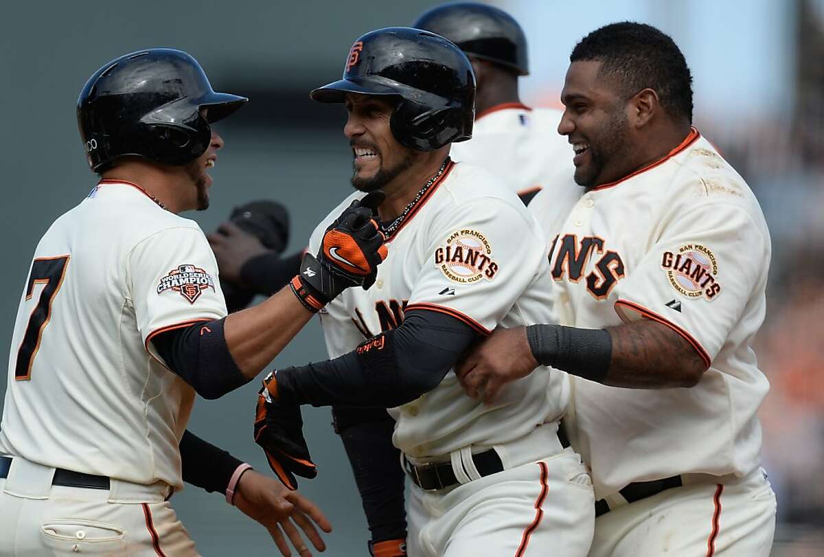 San Francisco Giants baserunner Pablo Sandoval scores on a double