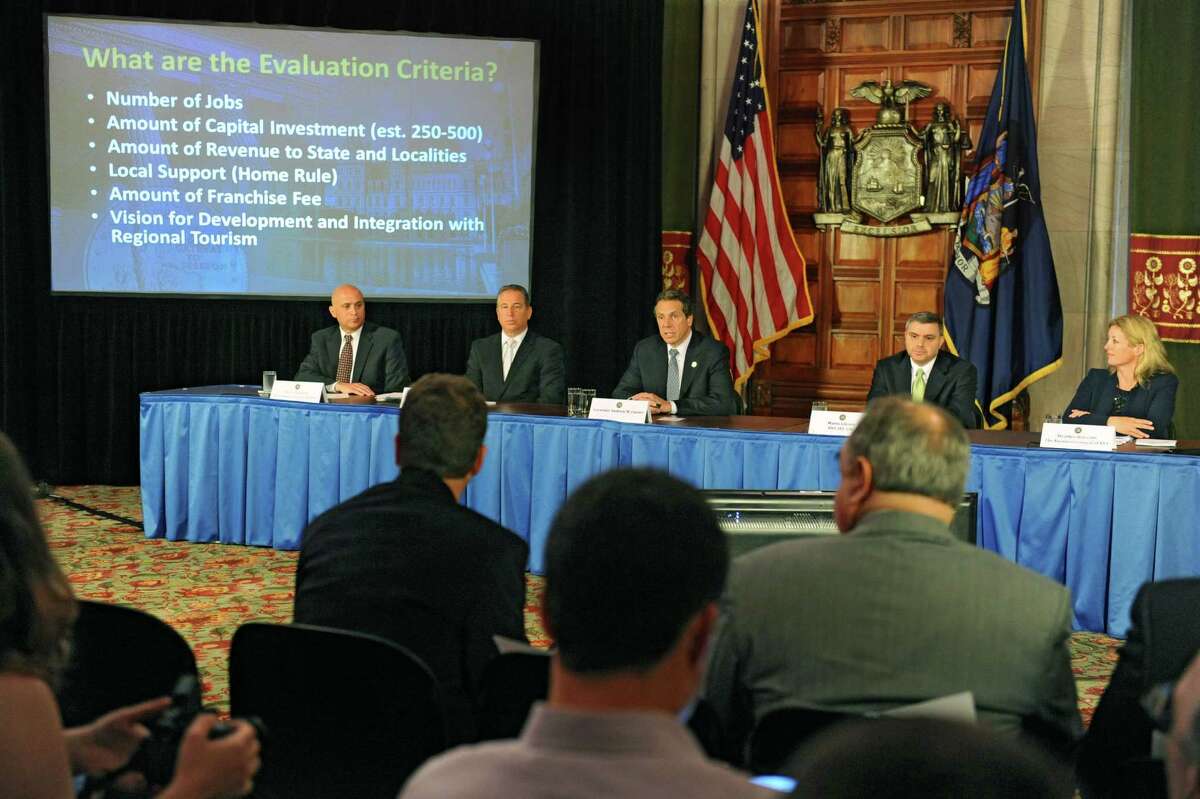 Governor Andew Cuomo, center, holds a press conference to discuss proposals on upstate casinos on Thursday, May 9, 2013 in Albany, N.Y. Also sitting with the governor, from left, are Steve Acquario, NYS Association of Counties, left, Howard Glaser, Director of State Operations, Mario Cilento, NYS AFL-CIO, and Heather Briccetti, The Business Council of NYS. (Lori Van Buren / Times Union)