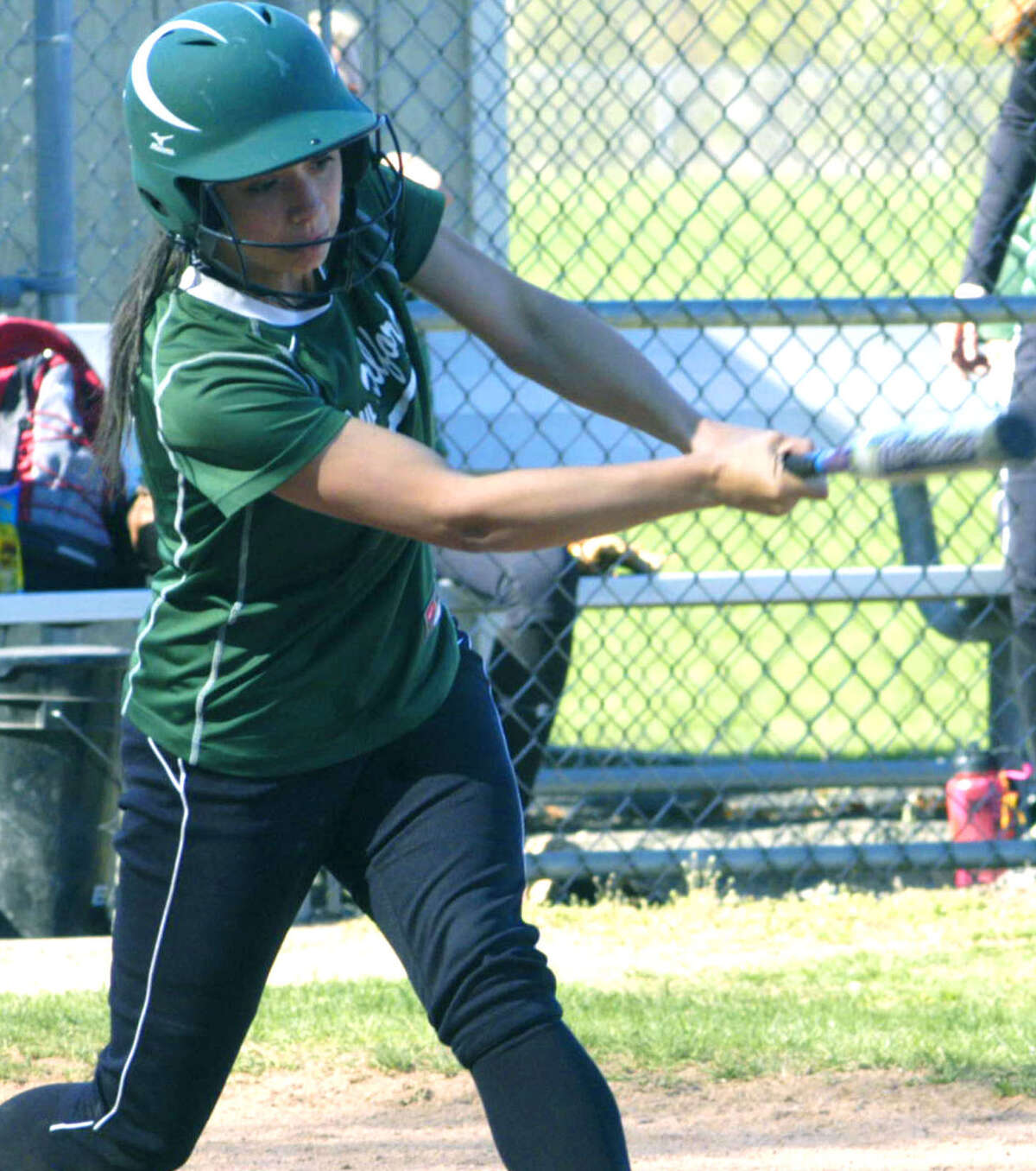 The Green Wave's Vienna Pallisco delivers yet another hit during a 12-1 victory for New Milford High School softball over Pomperaug, May 1, 2013 at NMHS.