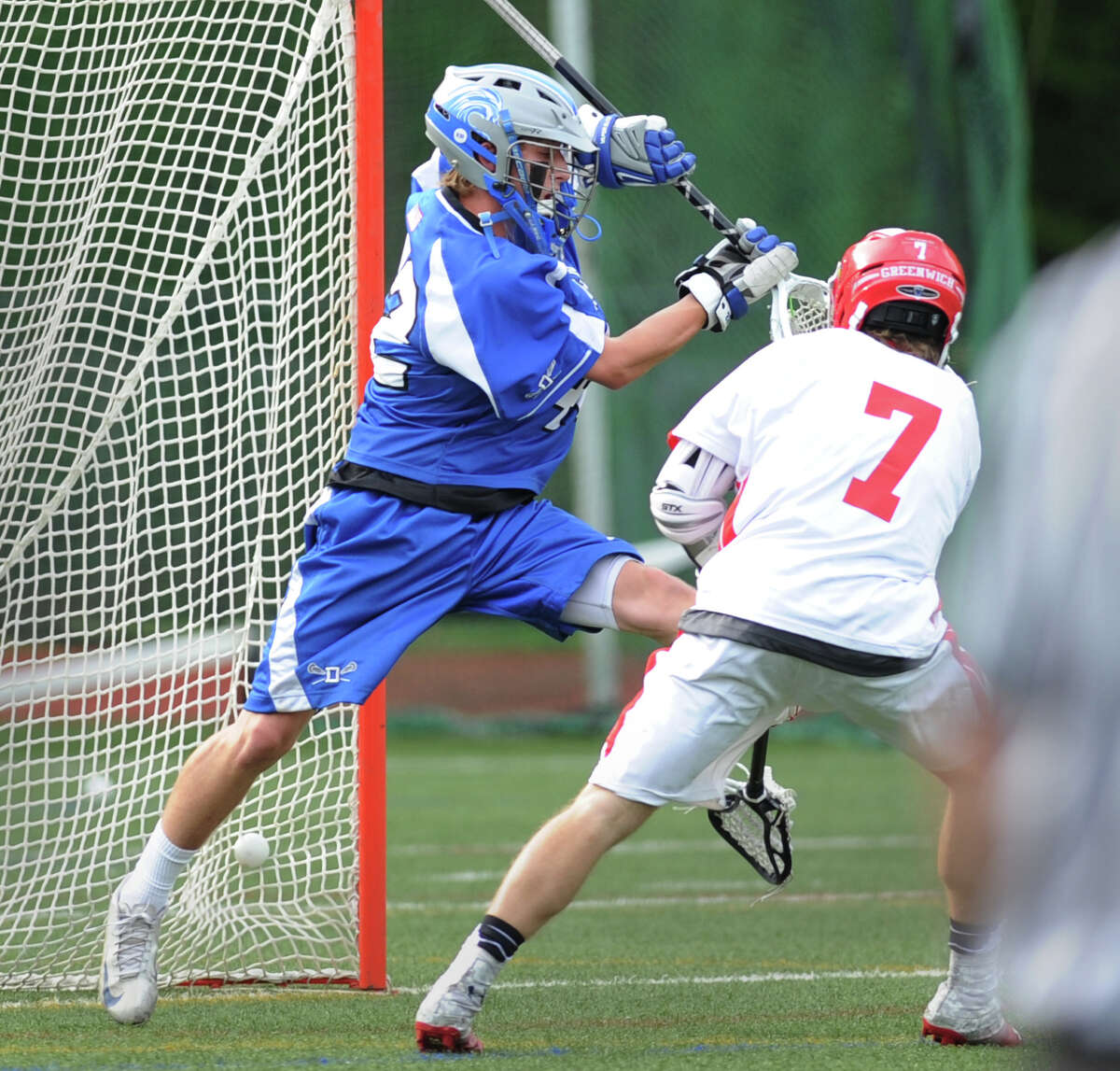 Darien goalie Phil Huffard, left, is unable to make the save on a goal by Jamie Paradise (# 7) of Greenwich during the boys high school lacrosse match between Greenwich High School and Darien High School at Greenwich, Friday, May 10, 2013. Greenwich defeated Darien, 8-6.