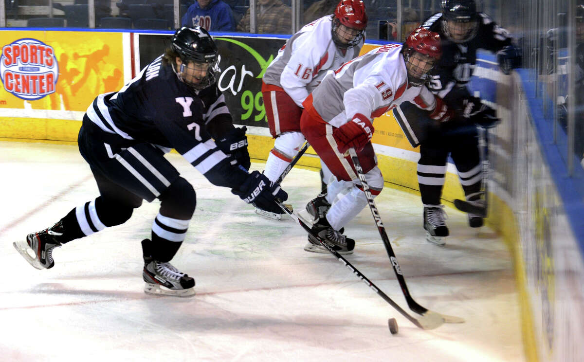 Yale's #7 Matt Killian, left, looks to intercept the puck from Sacred Heart University's #19 Chad Filteau, during men's ice hockey action at the Webster Bank Arena in Bridgeport, Conn. on Tuesday November 22, 2011.