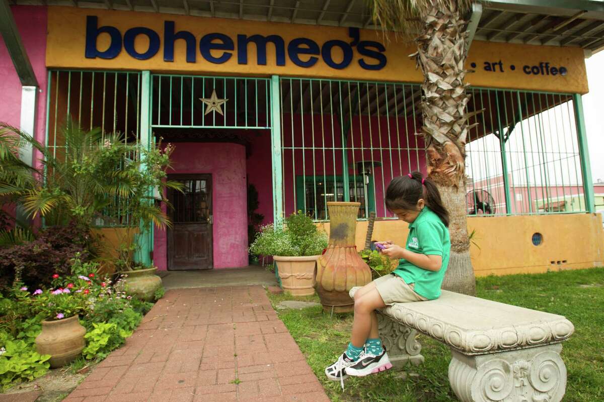 Six-year-0ld Umi Dealejandro enjoys the courtyard at Bohemeo's.