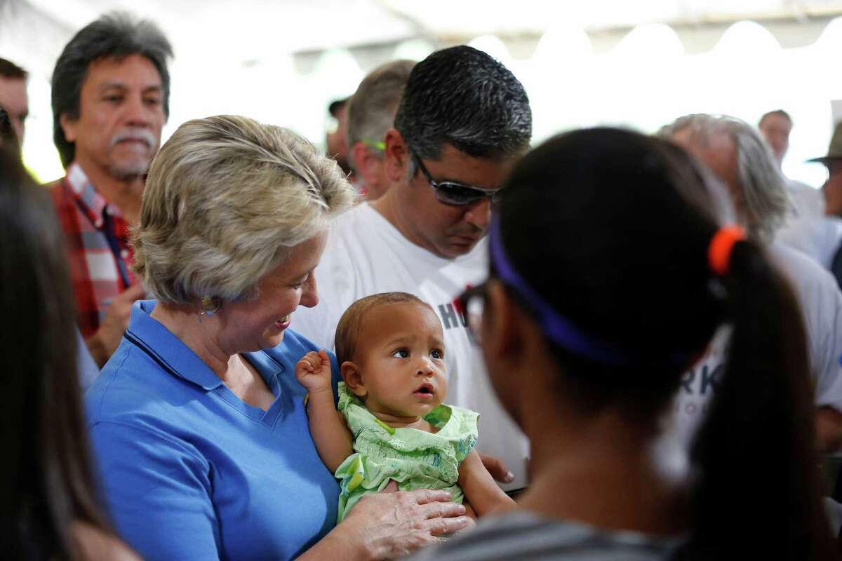 Houston mayor, Annise Parker, holds "campaign baby", Alejandra Daniels, Saturday, May 11, 2013 during a rally to officially announce her run for a third mayoral term, at Stude park in Houston, Texas. (TODD SPOTH FOR THE CHRONICLE)