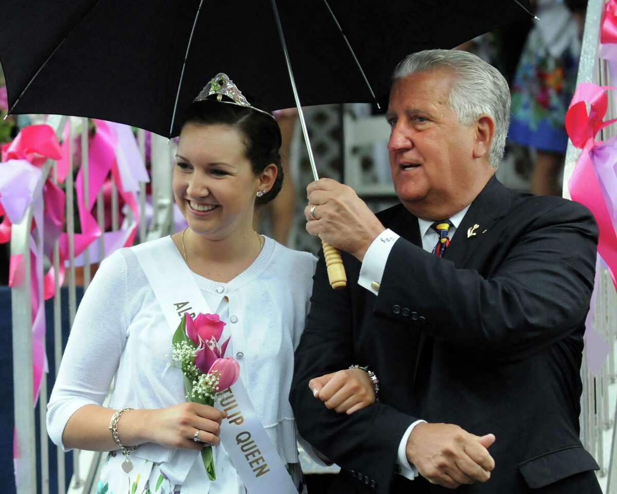 Mayor Jerry Jennings escorts Tulip Queen Kate Bender, 18, of Slingerlands following the coronation during the Tulip Festival on Saturday, May 11, 2013, at Washington Park in Albany, N.Y. (Cindy Schultz / Times Union)