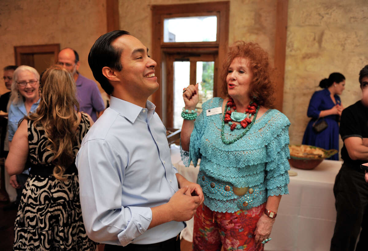 Mayor Julian Castro laughs while talking with Dr. Yvonne Katz during an election night rally Saturday.