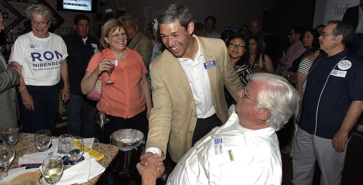 Ron Nirenberg, being congratulated at his election night party, took the most votes in his race, despite being easily outspent by opponent Rolando Briones.