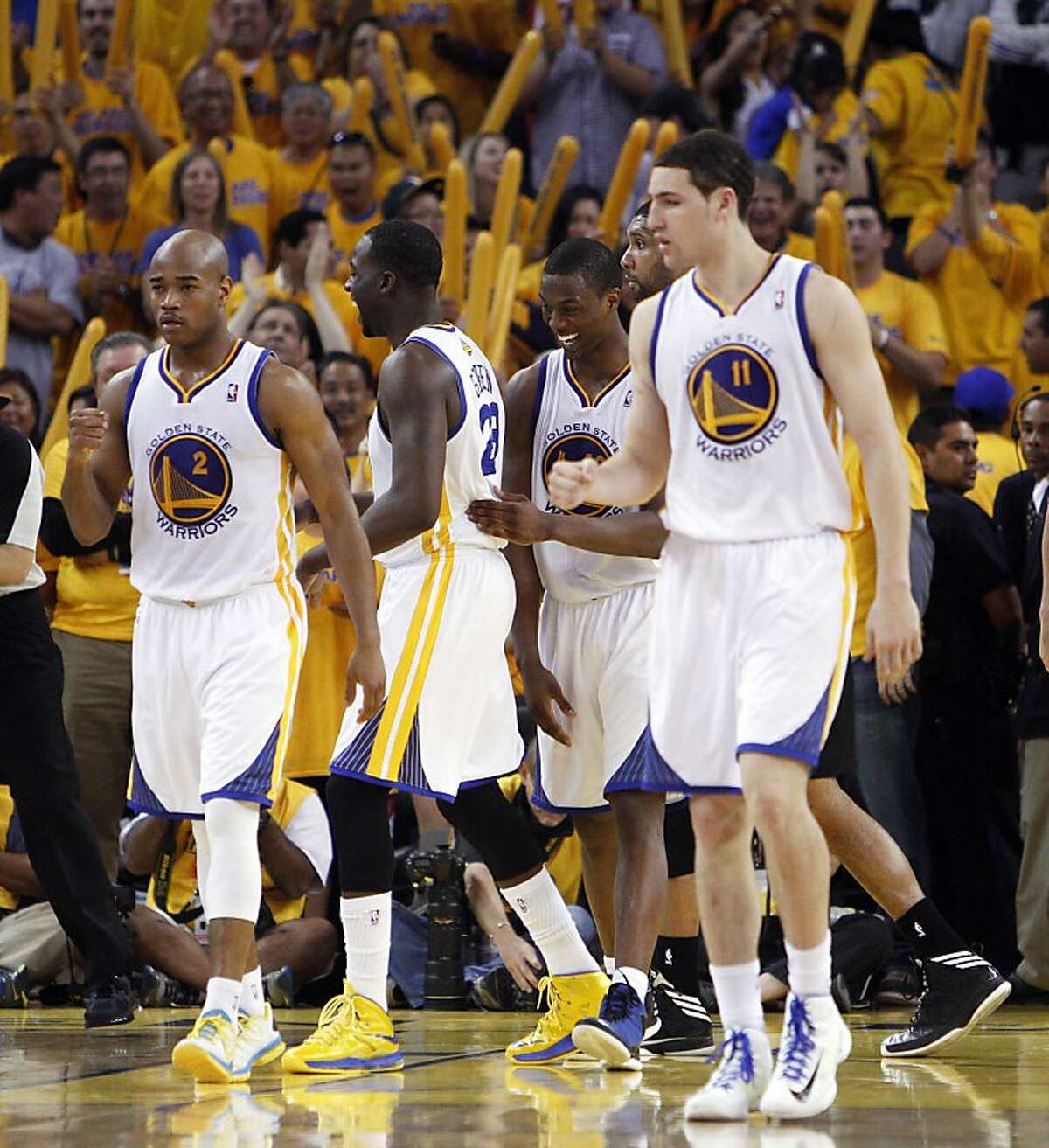 Warriors beat Spurs in OT, even series