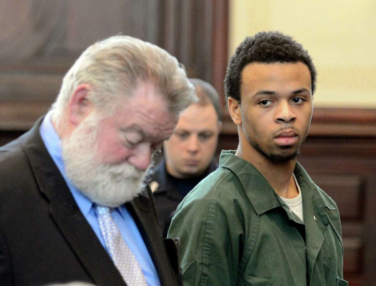 Ravenal Gregory "Kannons" Dunbar appears in front of Judge Patrick McGrath with his attorney Robert Knightly, left, to take a plea in the murder case of Takim Smith May 13, 2013 in the Rensselear County Courthouse in Troy, N.Y. (Skip Dickstein/Times Union)