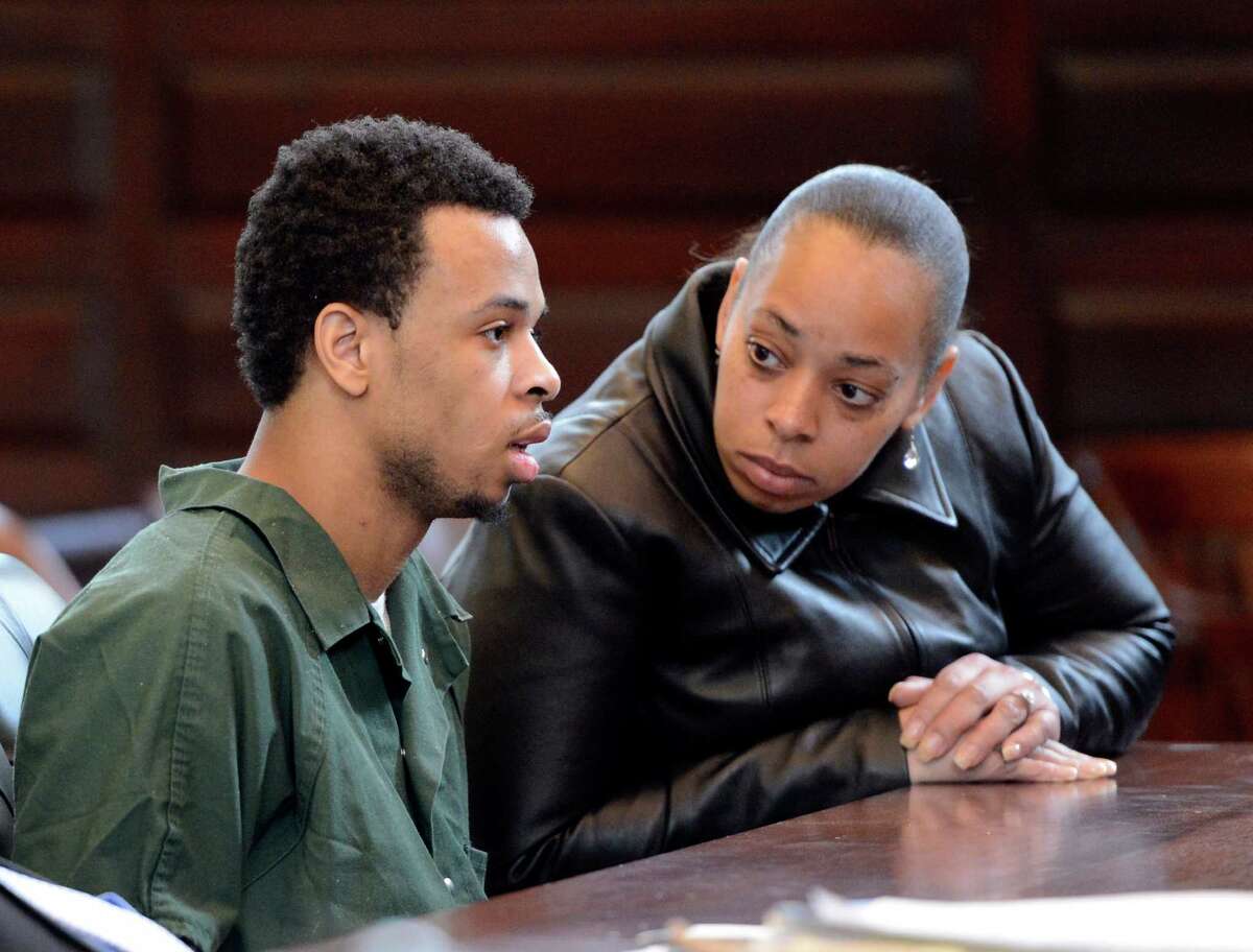 Ravenal Gregory "Kannons" Dunbar discusses his situation with his mother Rachel Paige, right before taking a plea in the murder case of Takim Smith May 13, 2013 in the Rensselear County Courthouse in Troy, N.Y. (Skip Dickstein/Times Union)