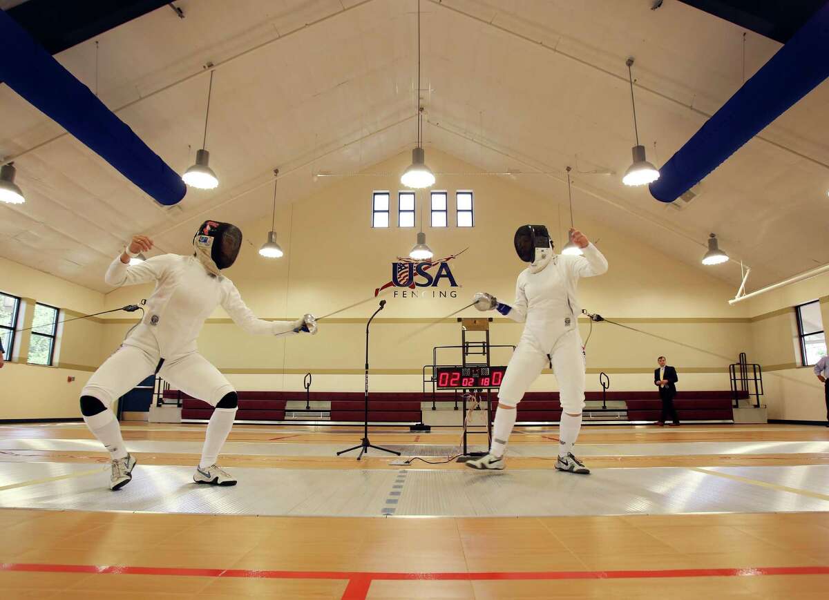 Olympic fencing bronze medal winners Kelley and Courtney Hurley, provide a fencing demonstration during the grand opening celebration for the University of the Incarnate Word's Brain Power Center for Fencing and International Sports on Monday May 13, 2013. The 18,000 square-foot facility includes eight fencing strips, practice strips and a gymnasium that can be used for basketball and volleyball. There is also an international sports area for badminton and table tennis along with an armory. UIW is hoping to develop an NCAA fencing program and provide facilities for a U.S Fencing Association club. The facility will also serve as a training facility for fencing athletes and host competitions.
