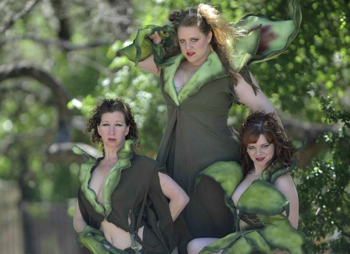 Belinda Harolds (from left), Sara Brookes and Morgan Clyde play the plant in “Little Shop of Horrors” at the Vex.
