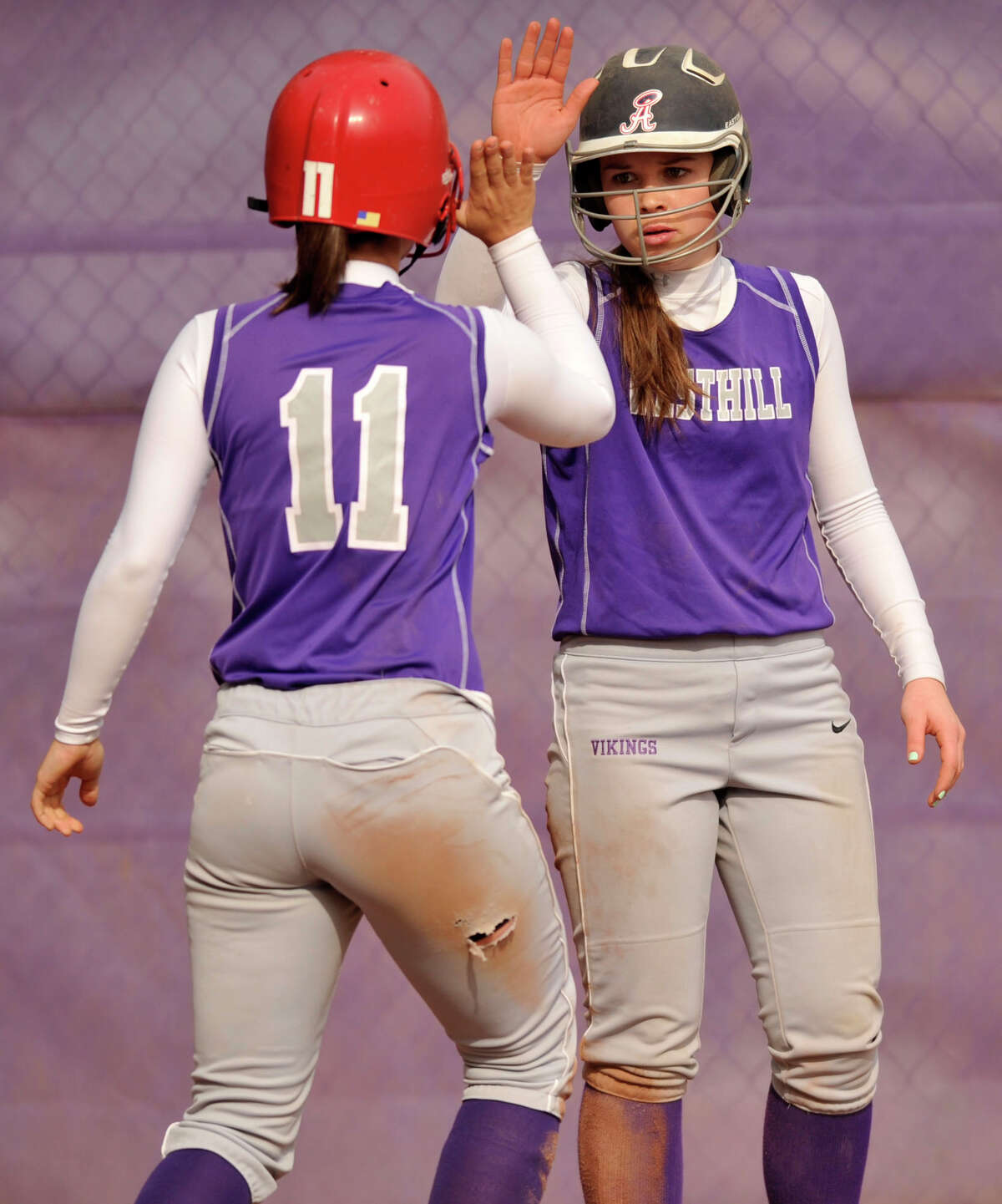 Westhill's Kate Brainard, left, and Morgan Kurtz celebrate both scoring against New Canaan at Westhill High School on Tuesday, May 14, 2013. Westhill won, 4-3.