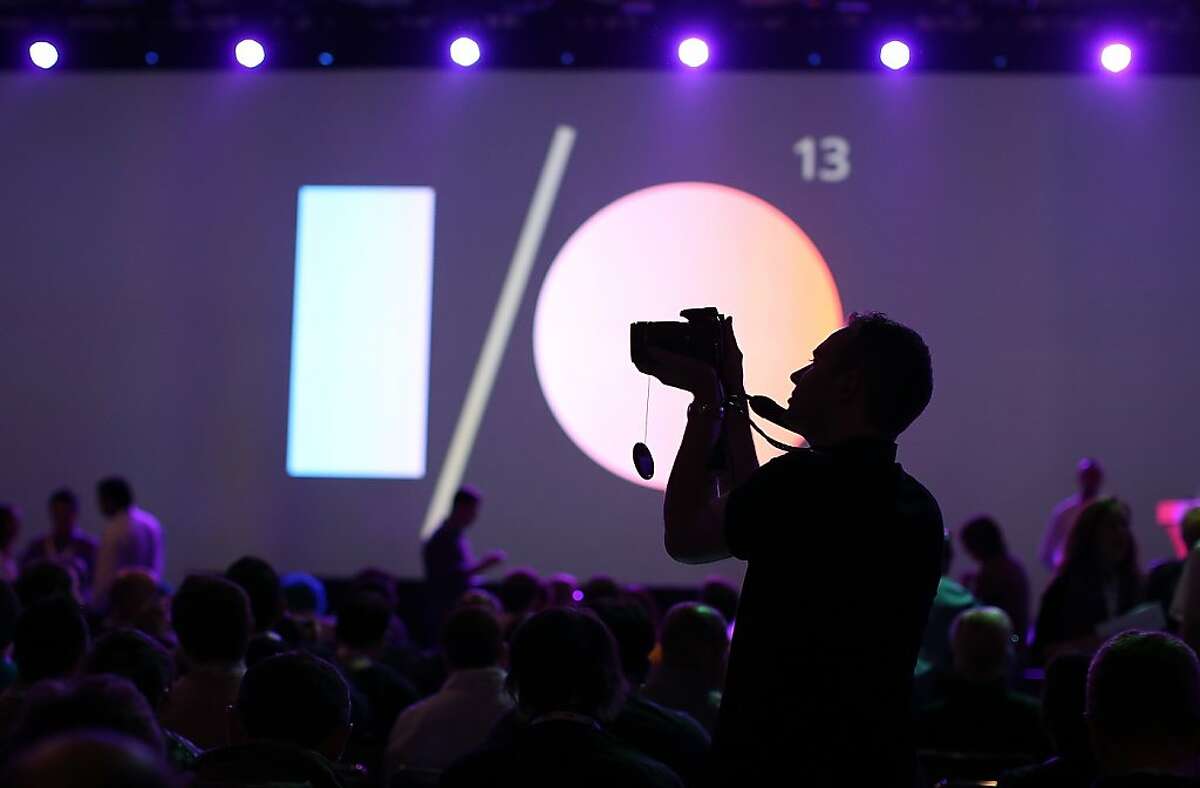 An attendee uses a camera to take pictures before the start of the opening keynote at the Google I/O developers conference at the Moscone Center on May 15, 2013 in San Francisco, California. Thousands are expected to attend the 2013 Google I/O developers conference that runs through May 17.
