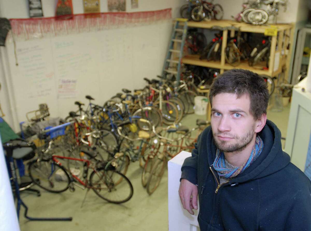 TIMES UNION / LUANNE M. FERRIS--Andrew Lynn, cq., of Troy Bike Rescue, on Monday, Jan. 19, 2008, in the recycling shop in Troy, NY. The rescue takes in donated and found bikes repairs them and then redonates them to others or offers them to the public for a small donation for the center.