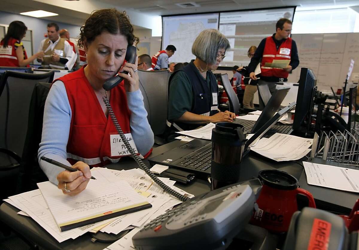 Ellen Levin, from the city's PUC, monitors water quality during a simulated disaster drill at the emergency Operations Center after a projected 7.8 magnitude earthquake in San Francisco, Calif. on Wednesday, May 15, 2013.