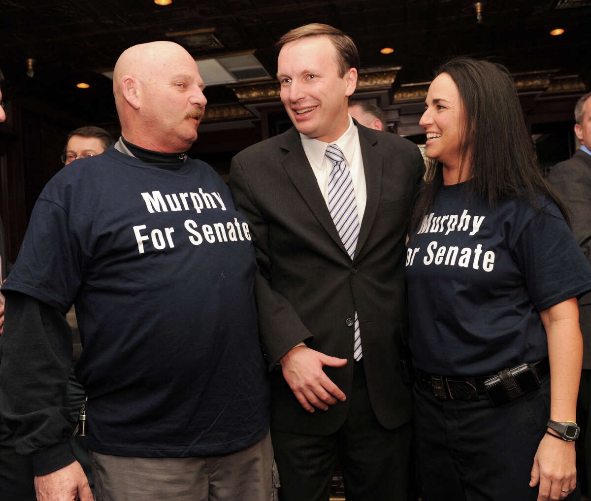 Ray Soucy, left, of AFSCME Local 391, the corrections officers union, with Congressman Chris Murphy and Lisamarie Fantano of East Hampton, after Murphy announced his intention to run for the senate on Thursday, Jan. 20, 2011. Soucy told Dan Malloy he had not showed sufficient respect to his union members drawing a salty retort from the governor.