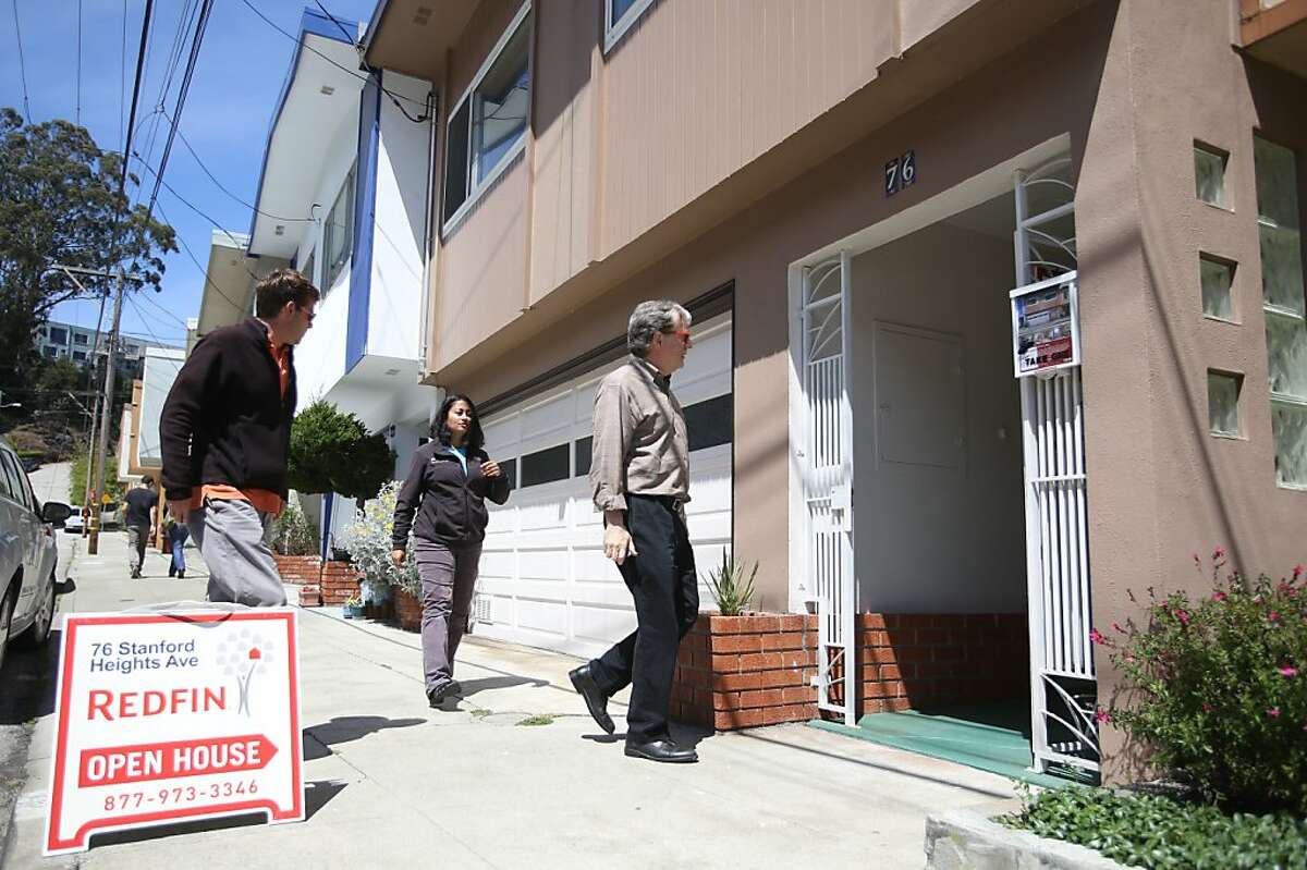 Achim Albrecht, left, Mamata Kene, center, and Whitney Davis enter an open house for sale on Stanford Heights Ave. in San Francisco on Sunday, May 12, 2013.
