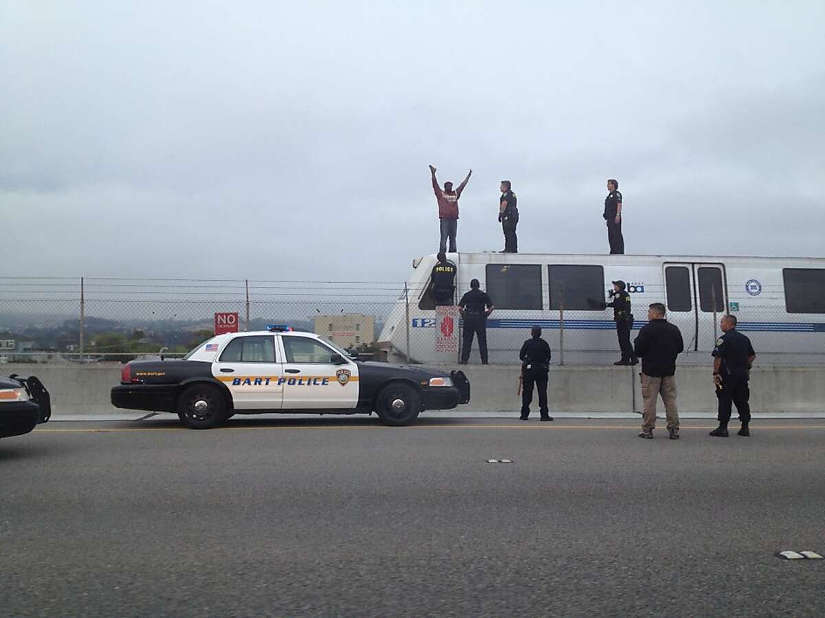 BART halted when man jumps on train roofs