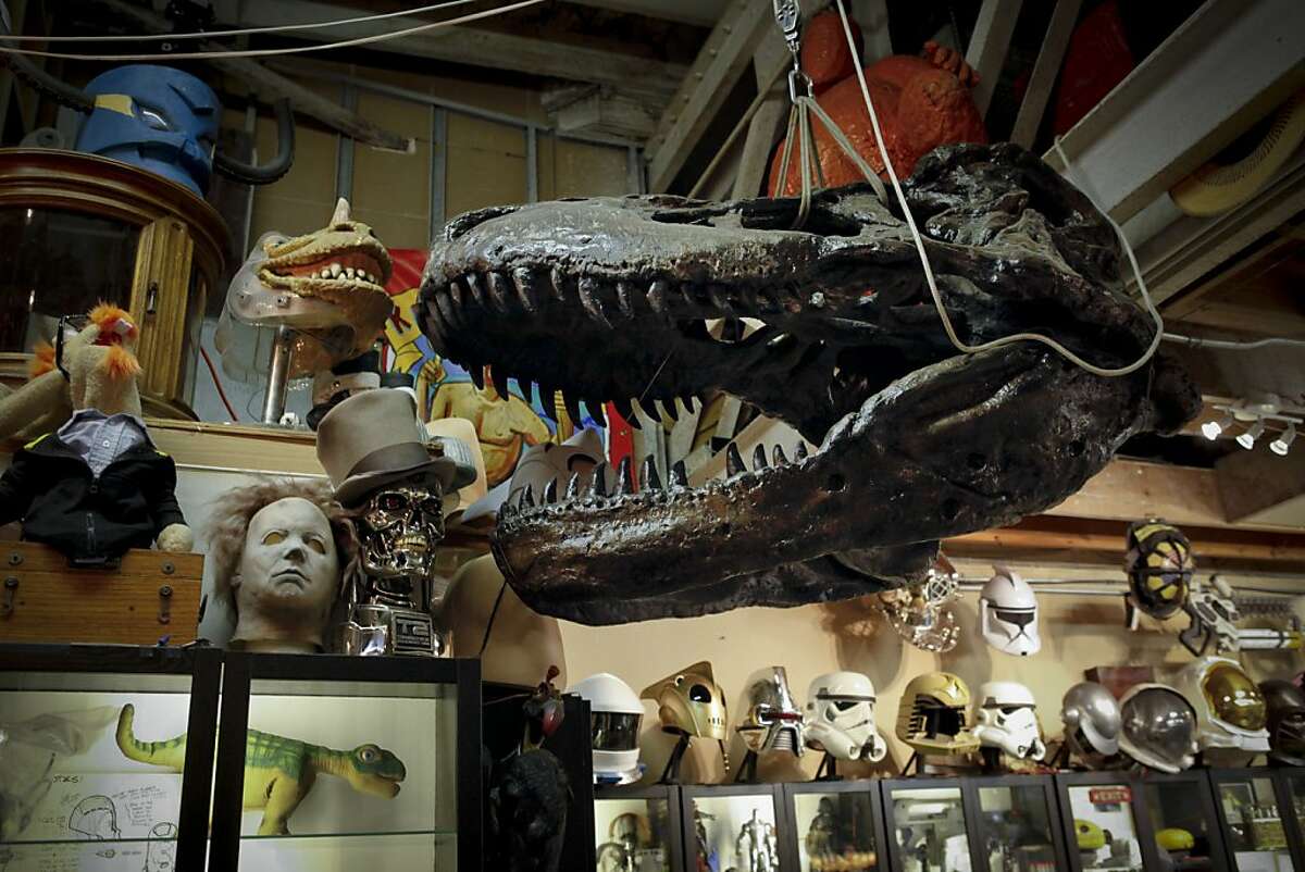 Adam Savage, one of the hosts of the television show, "Mythbusters," has a casting of a dinosaur head in his Mission district workshop known as, "The Cave," on Monday, April 29, 2013 in San Francisco, Calif.